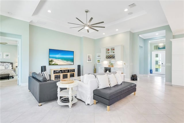 9215 Orchid Cove Cir, Vero Beach, FL 32963 - living area featuring a ceiling fan, a tray ceiling, light tile patterned flooring, wine cooler, and recessed lighting