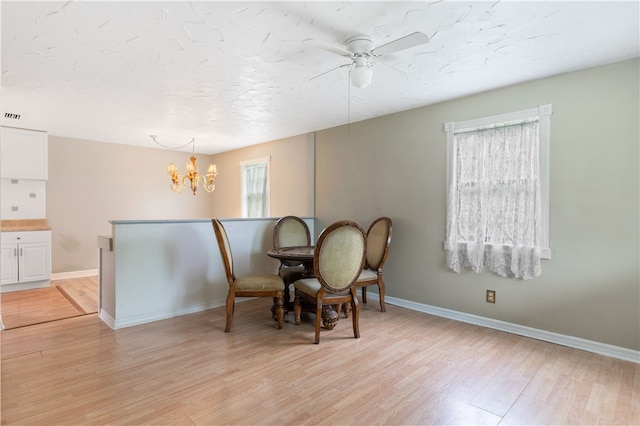 sitting room featuring light hardwood / wood-style floors and ceiling fan with notable chandelier