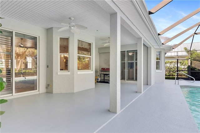 unfurnished sunroom with a healthy amount of sunlight and ceiling fan