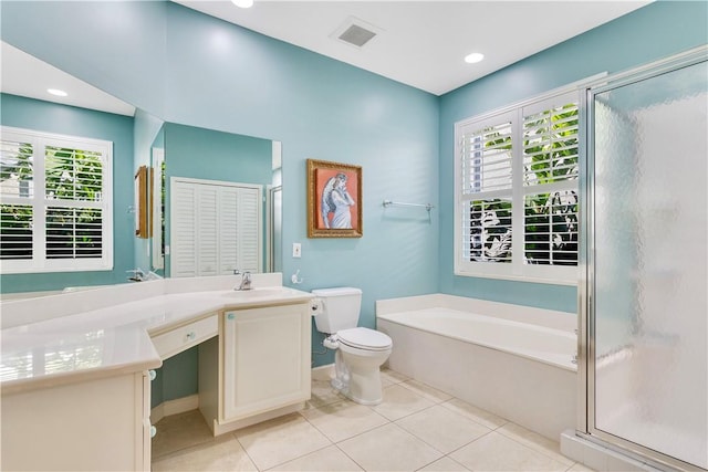 full bathroom with vanity, toilet, a healthy amount of sunlight, and tile patterned floors