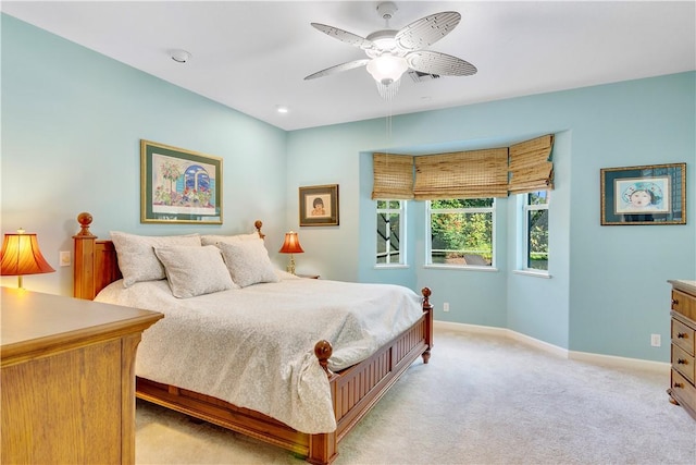 bedroom with light carpet and ceiling fan