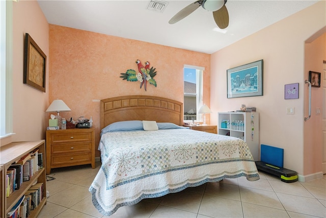 bedroom featuring ceiling fan and light tile patterned floors