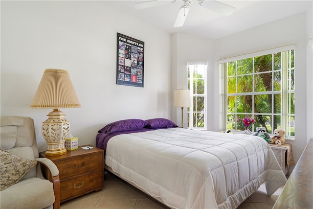 tiled bedroom with ceiling fan