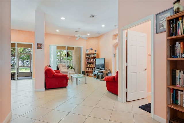 living room featuring ceiling fan and light tile patterned floors