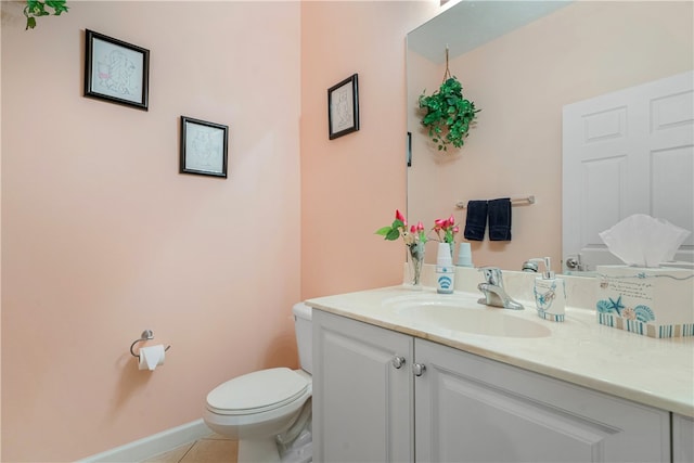 bathroom with vanity, tile patterned floors, and toilet