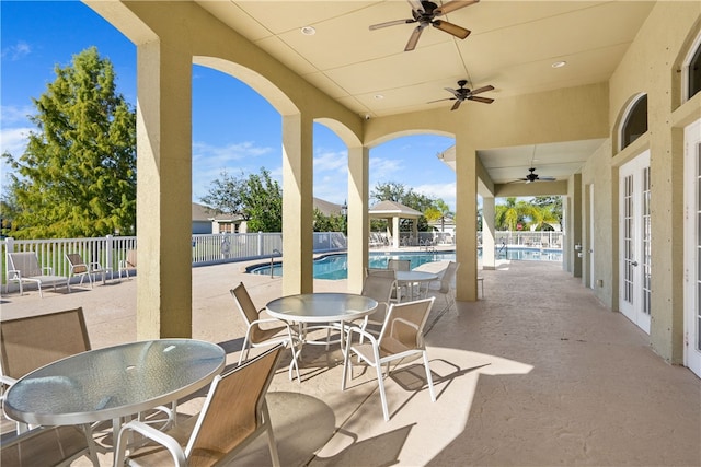 3255 W Brookfield Way, Vero Beach, FL 32966 - view of patio / terrace with french doors, ceiling fan, and a community pool
