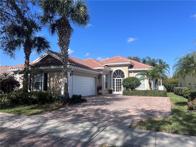 mediterranean / spanish-style house featuring a garage