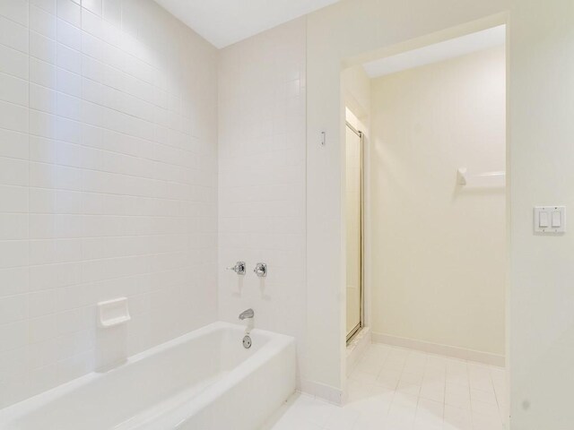 5540 N Harbor Village Dr Unit 103, Vero Beach, FL 32967 - full bathroom with tile patterned floors and baseboards