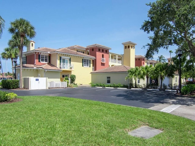 5540 N Harbor Village Dr Unit 103, Vero Beach, FL 32967 - view of building exterior with uncovered parking