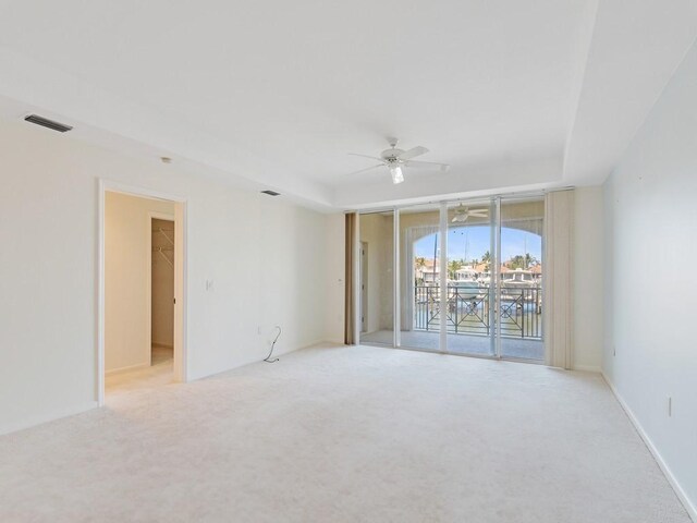 5540 N Harbor Village Dr Unit 103, Vero Beach, FL 32967 - spare room featuring ceiling fan and light colored carpet