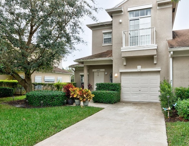 view of front of house featuring a garage and a balcony