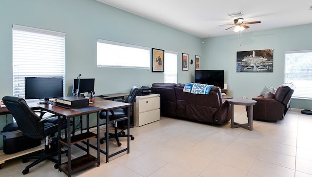 tiled office space with a wealth of natural light and ceiling fan