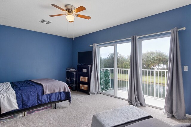 bedroom featuring ceiling fan, light carpet, and access to outside