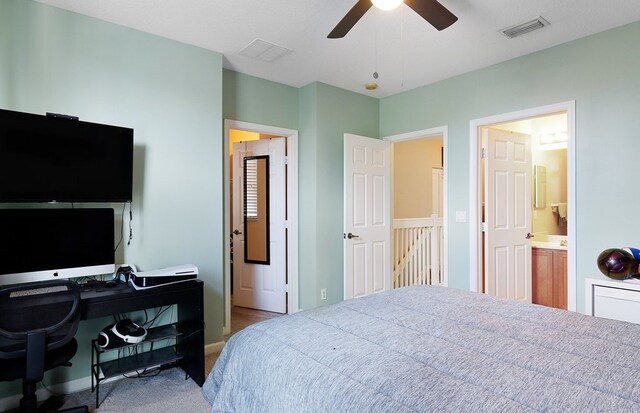 bedroom with ceiling fan and connected bathroom