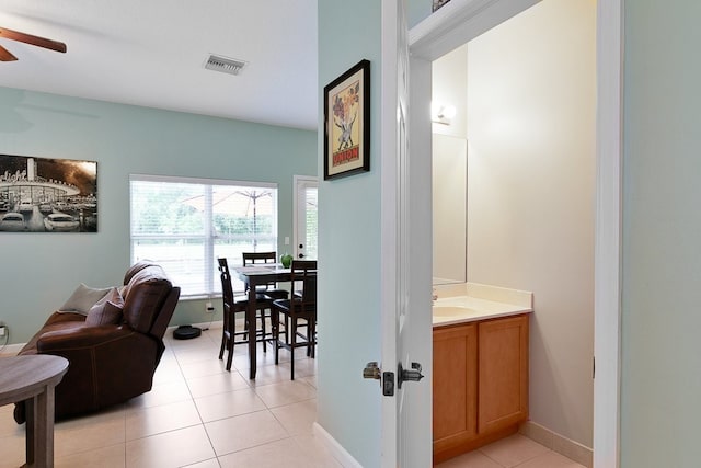 interior space with vanity, tile patterned flooring, and ceiling fan