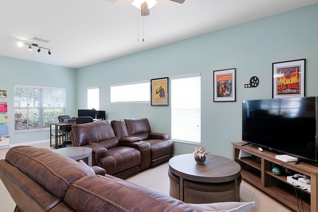 tiled living room with ceiling fan