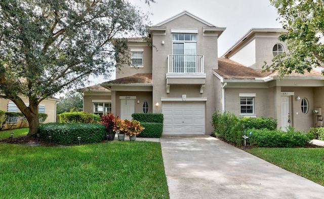 view of front of property featuring a front lawn and a garage