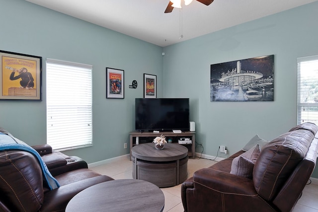 living room with ceiling fan and light tile patterned floors