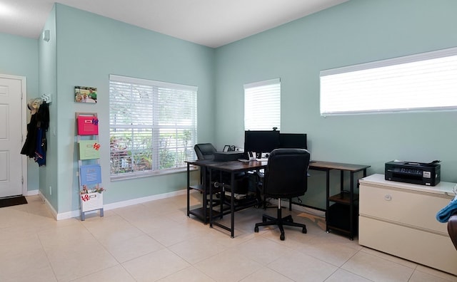 tiled office space featuring a healthy amount of sunlight