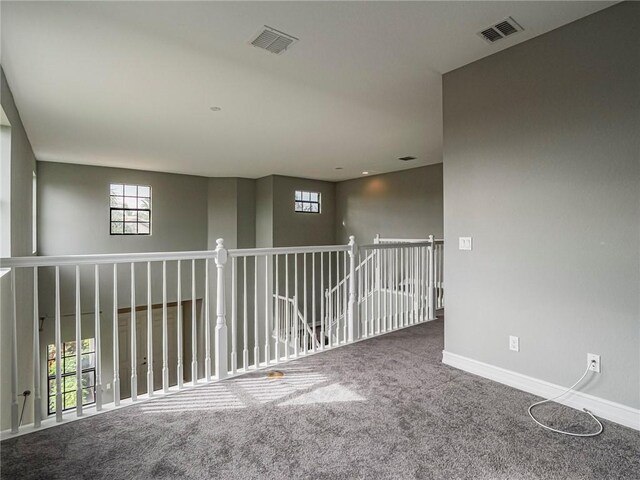 empty room with carpet flooring