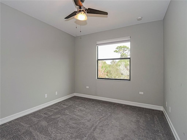 spare room featuring carpet floors and ceiling fan