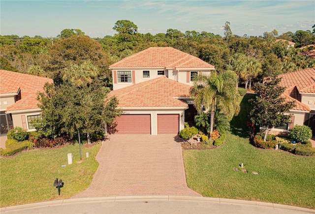 view of front of home with a garage and a front yard