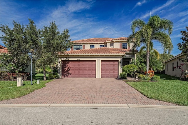 view of front facade with a front yard and a garage