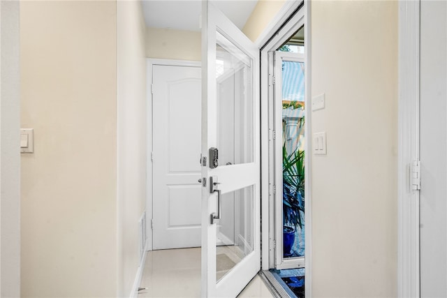 interior space with light tile patterned floors