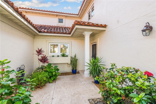 property entrance with a patio