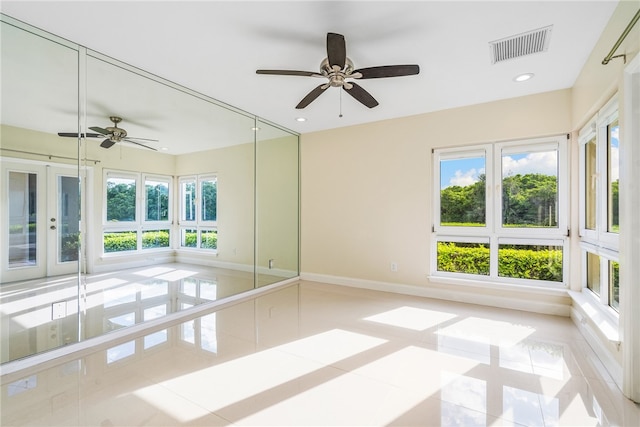 spare room featuring light tile patterned flooring