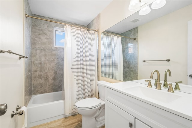 full bathroom featuring vanity, shower / bathtub combination with curtain, and toilet