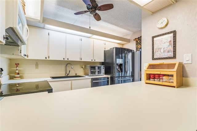 1170 6th Ave Unit 10A, Vero Beach, FL 32960 - kitchen with a sink, stainless steel fridge with ice dispenser, white microwave, dishwashing machine, and light countertops