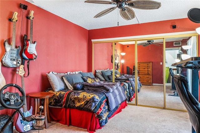 1170 6th Ave Unit 10A, Vero Beach, FL 32960 - carpeted bedroom featuring a textured ceiling, a closet, and ceiling fan
