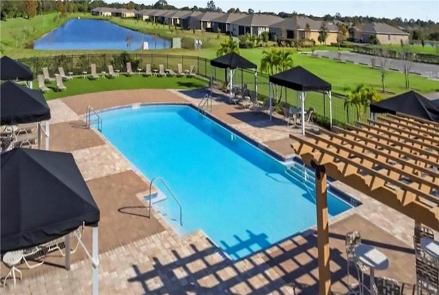 view of swimming pool featuring a gazebo, a water view, a yard, and a patio