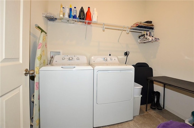 washroom featuring tile patterned flooring and independent washer and dryer