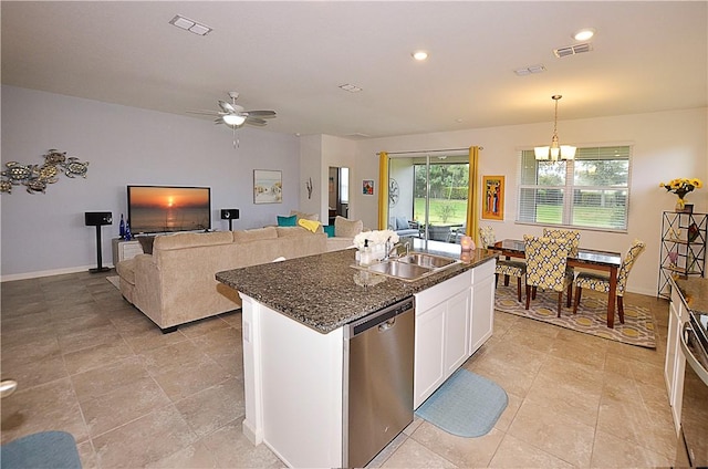 kitchen with sink, stainless steel dishwasher, an island with sink, decorative light fixtures, and white cabinets