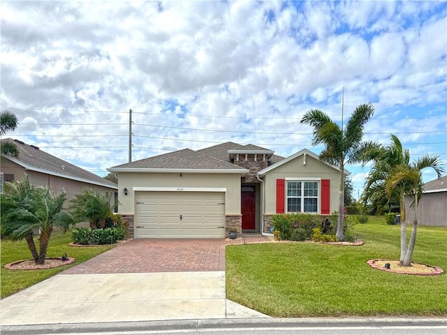 view of front of house featuring a front yard and a garage