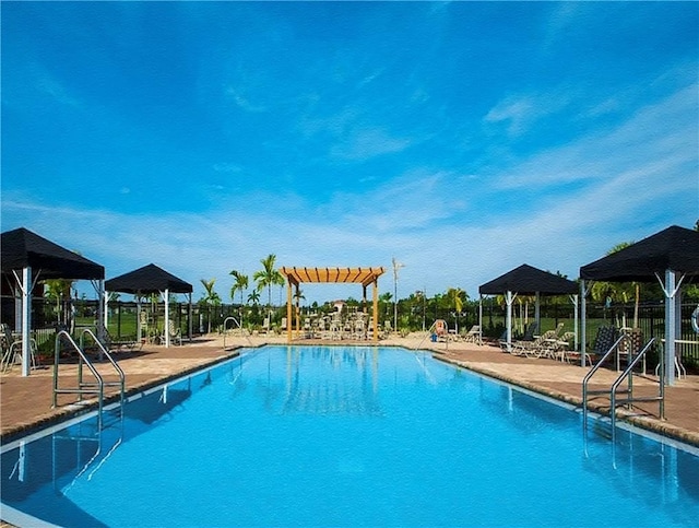 view of swimming pool featuring a gazebo and a patio area