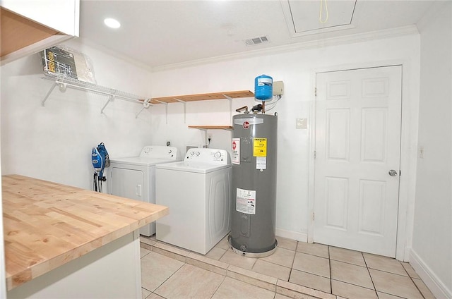 726 41st Ave, Vero Beach, FL 32968 - laundry room featuring water heater, independent washer and dryer, ornamental molding, light tile patterned flooring, and attic access