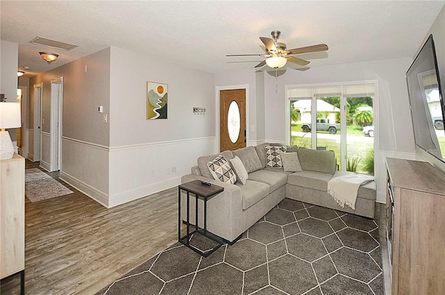 726 41st Ave, Vero Beach, FL 32968 - living room featuring ceiling fan, dark wood-type flooring, and baseboards
