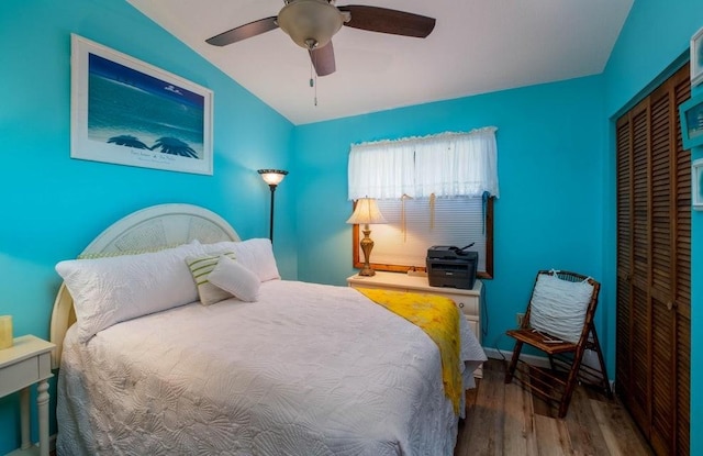 bedroom featuring wood finished floors, a closet, and ceiling fan