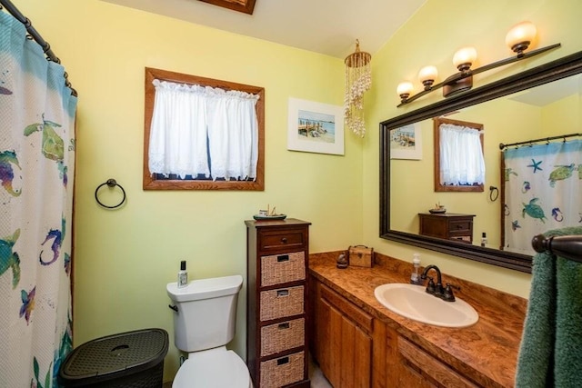 full bath with vanity, toilet, and a shower with shower curtain
