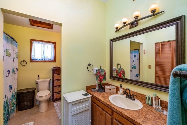 full bathroom featuring toilet, tile patterned floors, and vanity