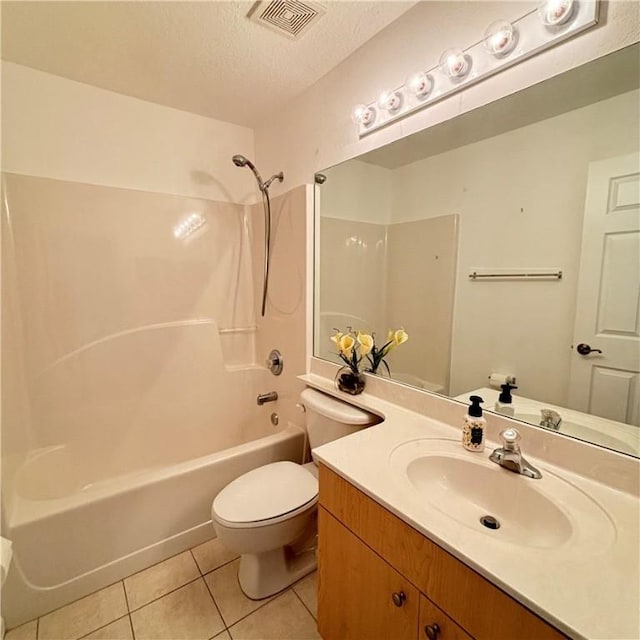 full bath featuring visible vents, toilet, a textured ceiling, shower / washtub combination, and tile patterned flooring