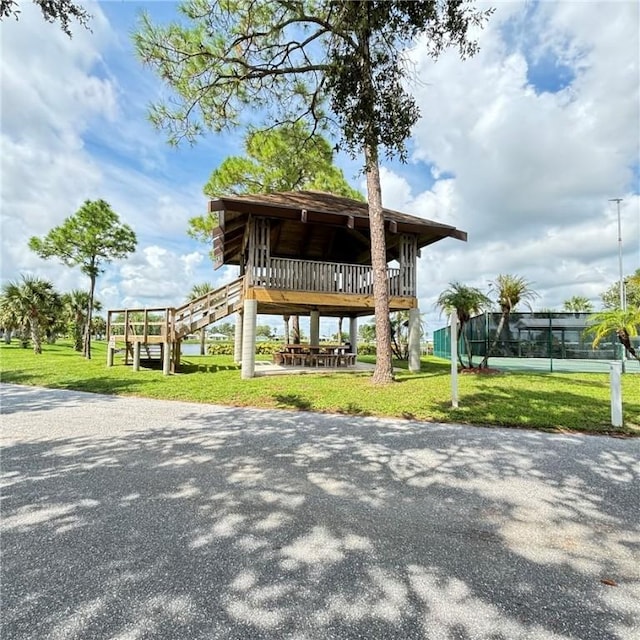 view of community featuring a lawn