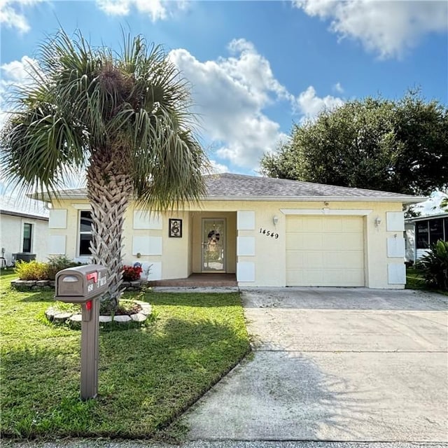 view of front facade with stucco siding, concrete driveway, a garage, and a front yard