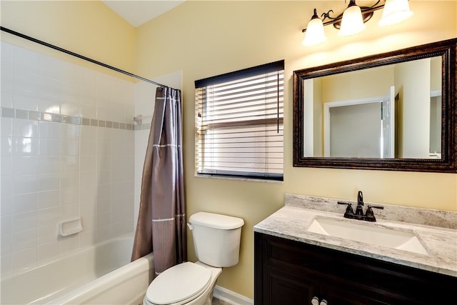 full bathroom with shower / tub combo, vanity, and toilet