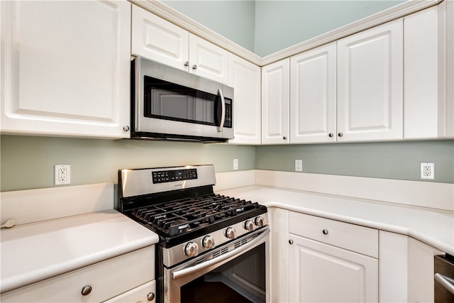 kitchen with white cabinetry and stainless steel appliances