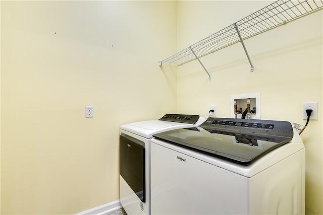 laundry room with independent washer and dryer