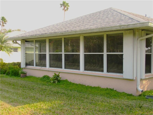 view of property exterior featuring a lawn